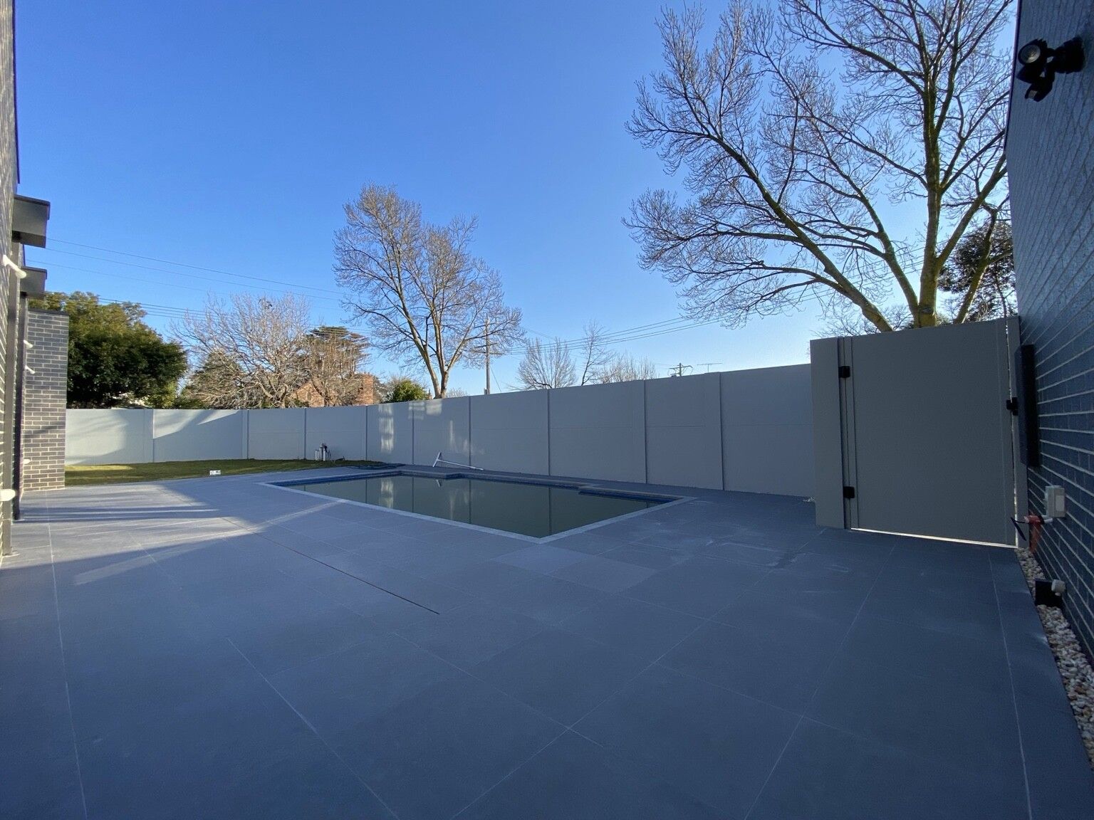 Ashburton pool project: VogueWall with 1200 mm blade fencing, pedestrian gates, sliding-gate package. Photo 3 of 6.