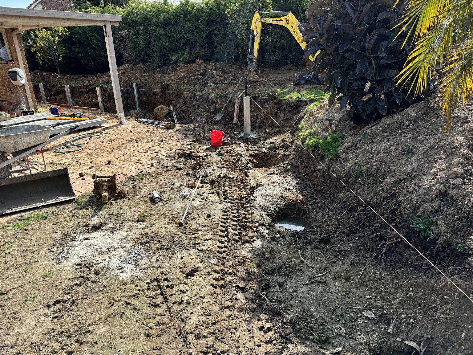 Berwick project: Concrete sleeper retaining wall with concrete sleepers, galvanised steel posts, integrated sleeper staircase. Photo 2 of 4.