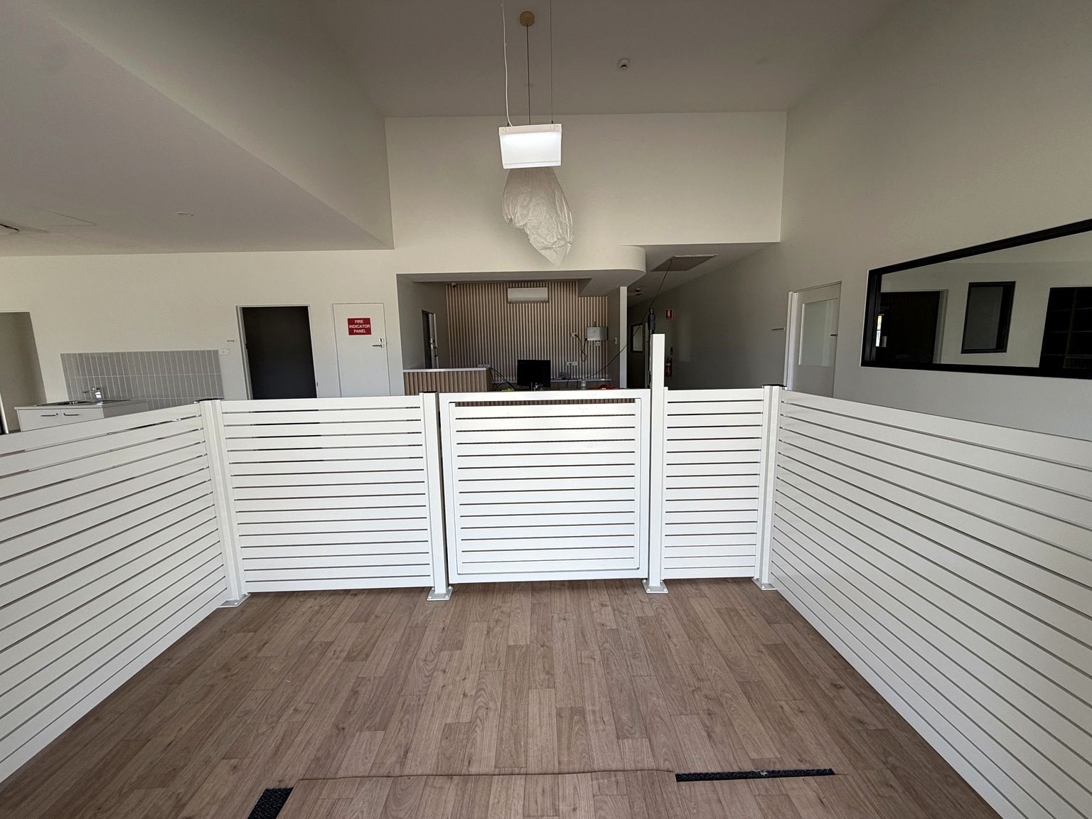 Craigieburn childcare project: SlimWall with slimwall painted to the project colour schedule, aluminium blade fencing, child-safe internal entry and muster-point gates. Photo 3 of 6.
