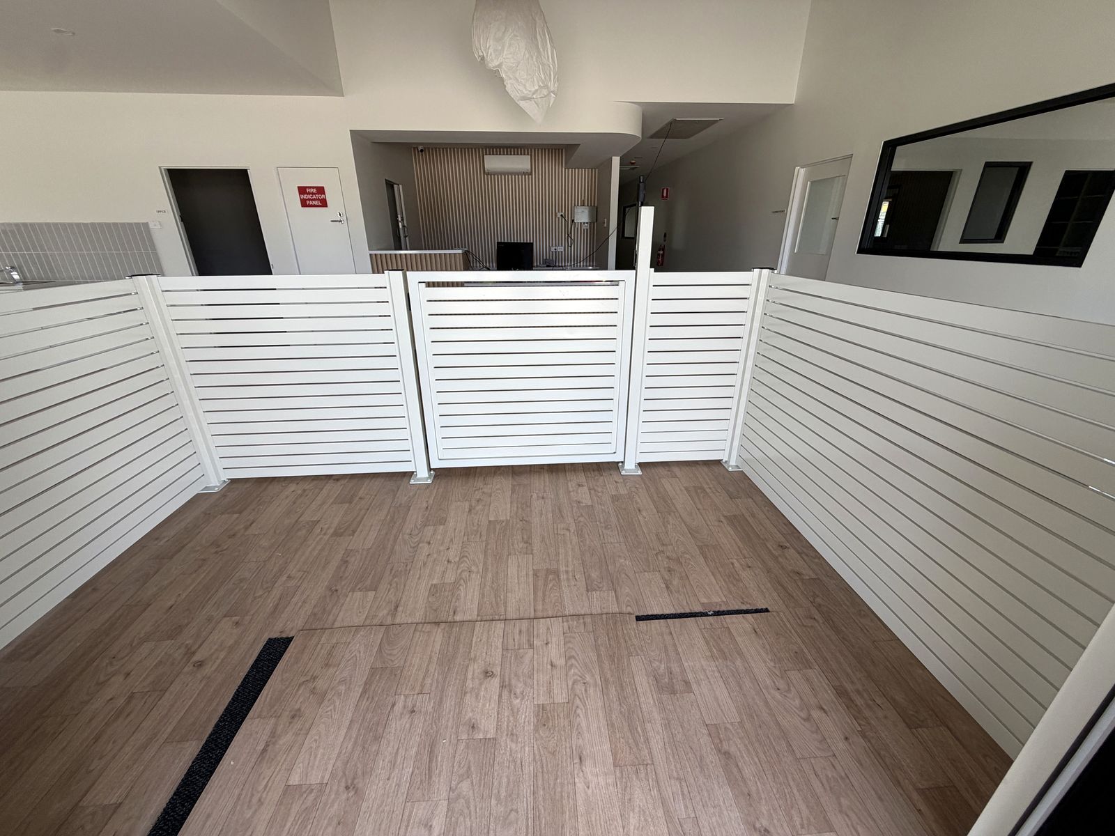 Craigieburn childcare project: SlimWall with slimwall painted to the project colour schedule, aluminium blade fencing, child-safe internal entry and muster-point gates. Photo 5 of 6.