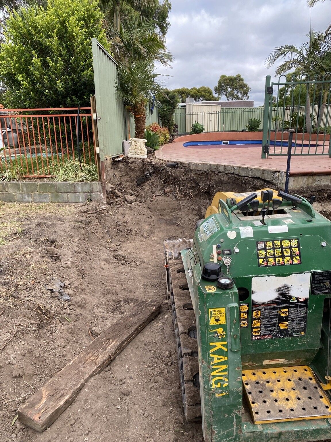 Endeavour Hills project: Concrete sleeper retaining wall with concrete sleepers, steel posts made to suit, access through the garage only. Photo 4 of 6.